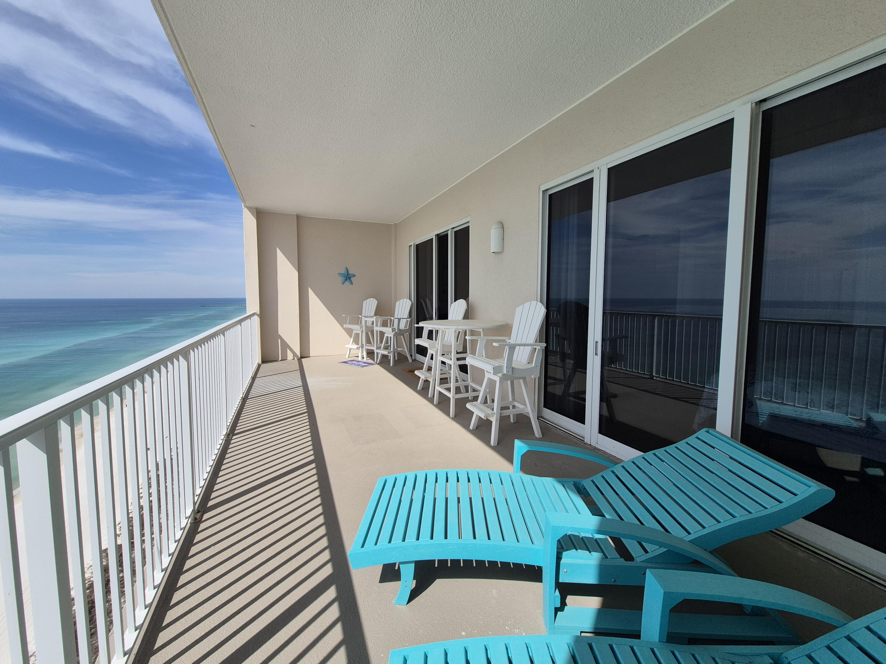 14415 Front Beach Road, Unit 2007 Panama City Beach, FL 32413 - Photo 2 of 26 a view of a porch with furniture and yard
