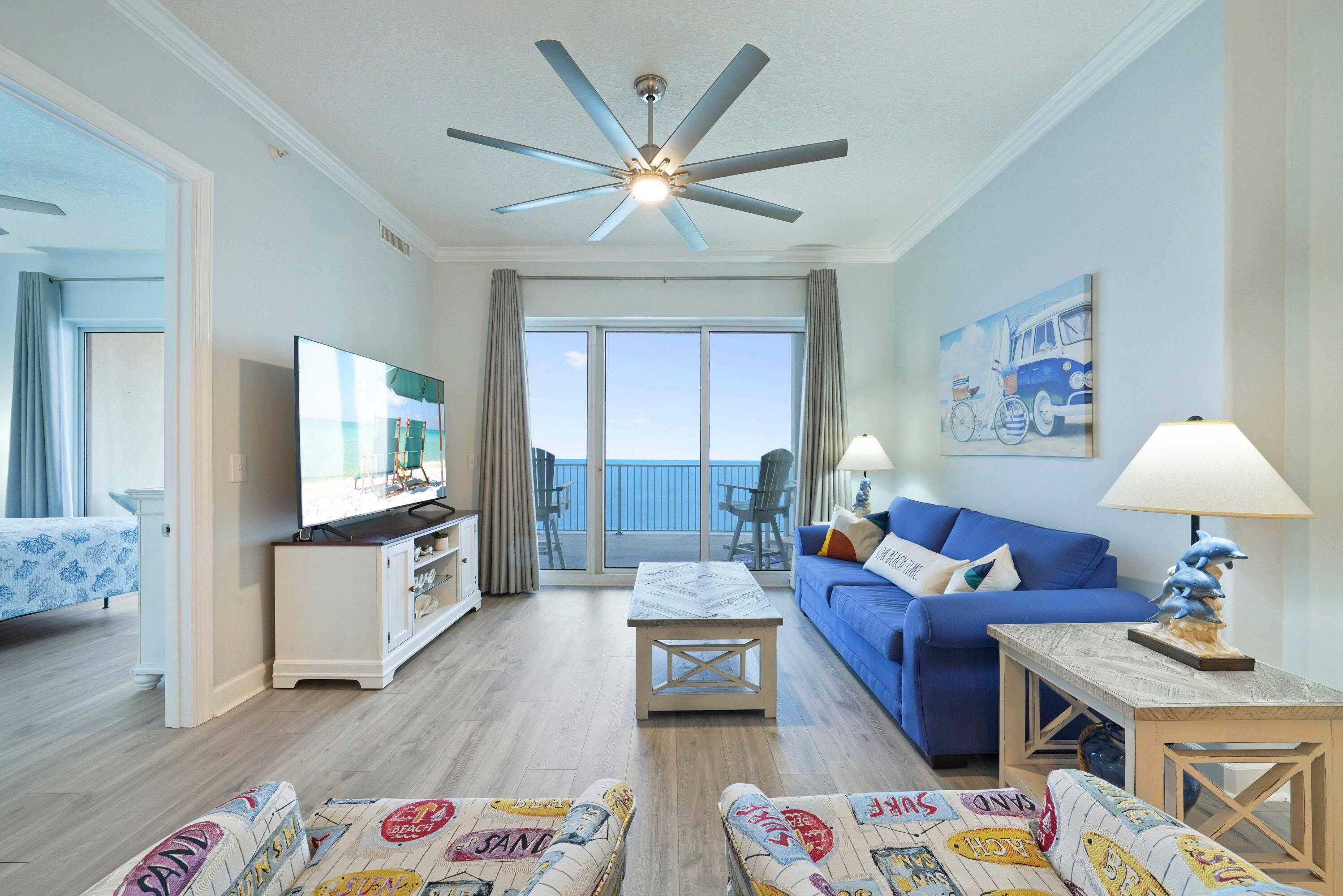 14415 Front Beach Road, Unit 2007 Panama City Beach, FL 32413 - Photo 5 of 26 a living room with furniture and a flat screen tv