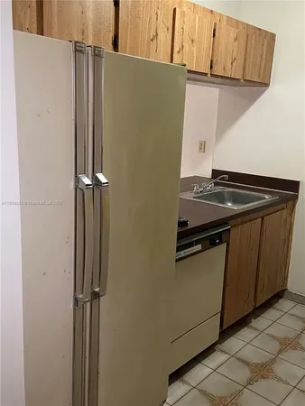 a view of a storage and utility room with washer and dryer