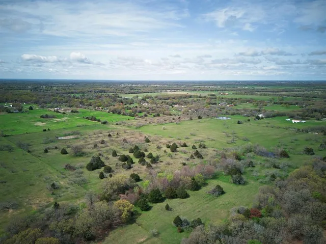 a view of a field with an outdoor space