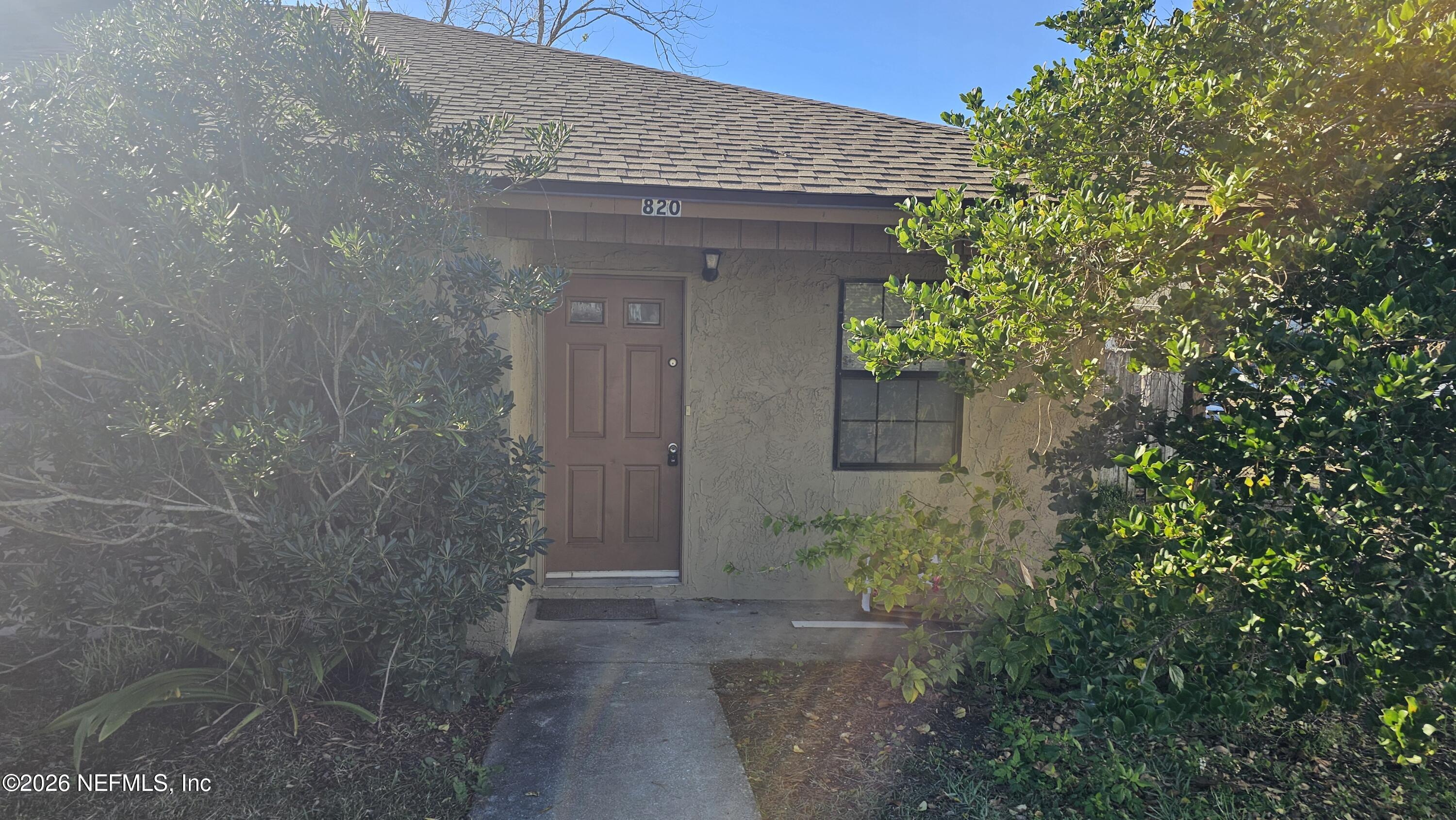 820 Orchid Street Atlantic Beach, FL 32233 - Photo 1 of 27 a view of a pathway of the house