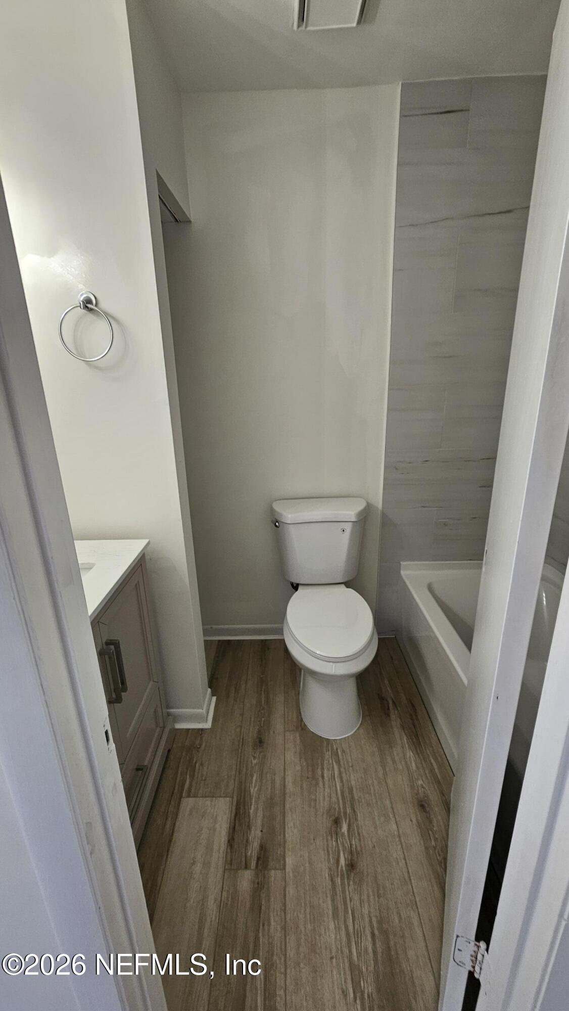 820 Orchid Street Atlantic Beach, FL 32233 - Photo 11 of 27 a white toilet sitting next to a sink