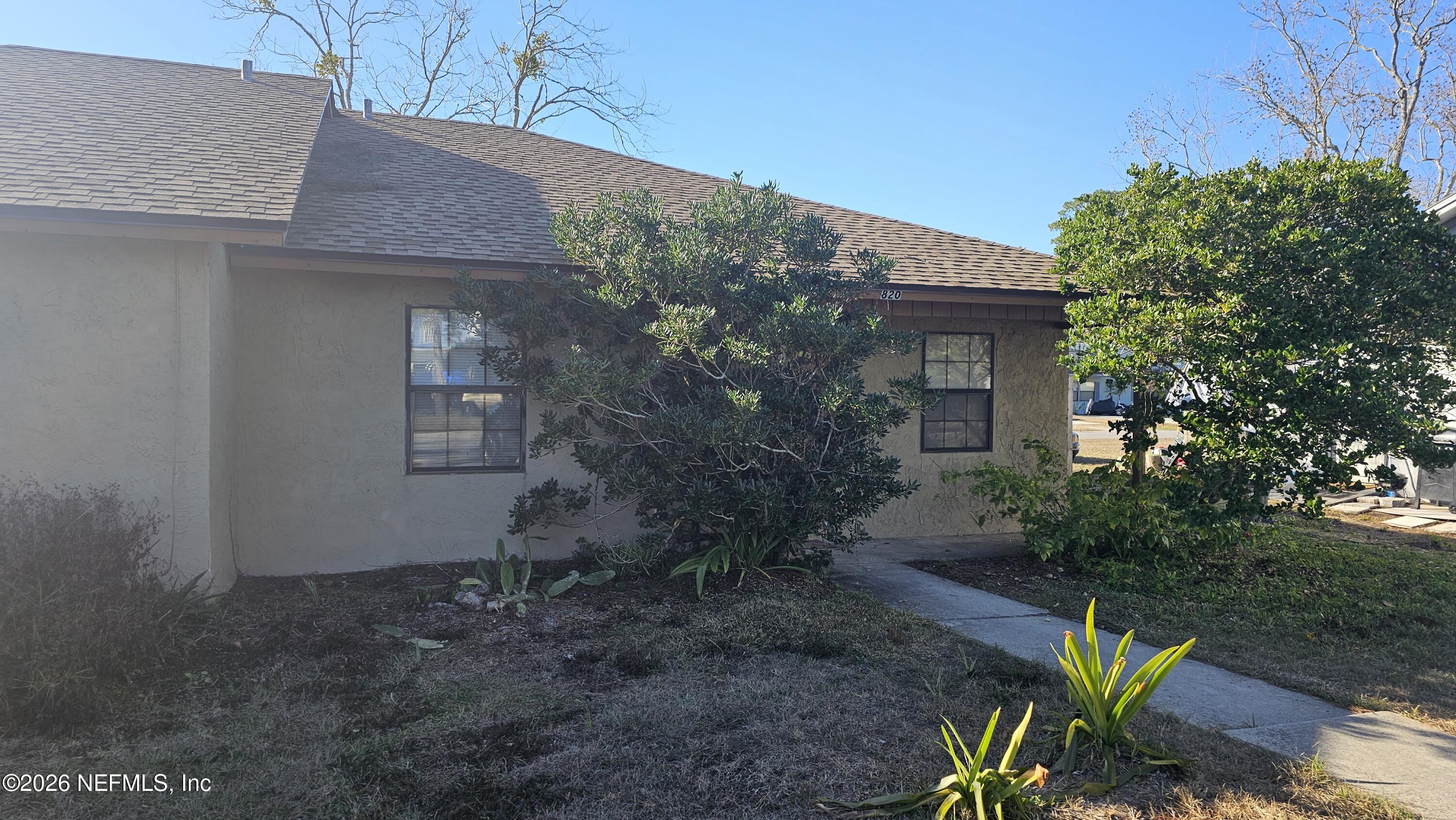 820 Orchid Street Atlantic Beach, FL 32233 - Photo 2 of 27 a house that has a tree in it