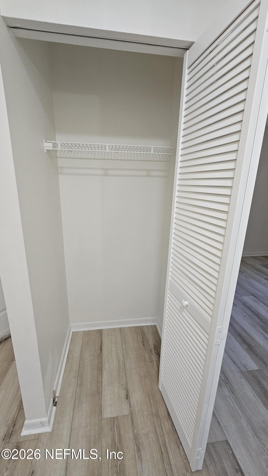 820 Orchid Street Atlantic Beach, FL 32233 - Photo 22 of 27 a view of a room with wooden floor