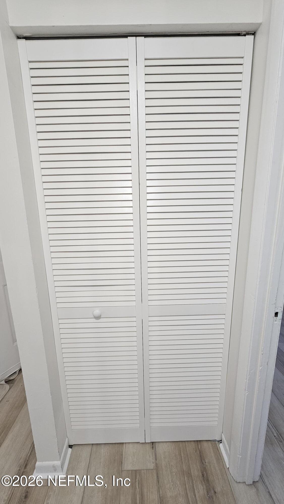 820 Orchid Street Atlantic Beach, FL 32233 - Photo 23 of 27 a view of a room with a white door