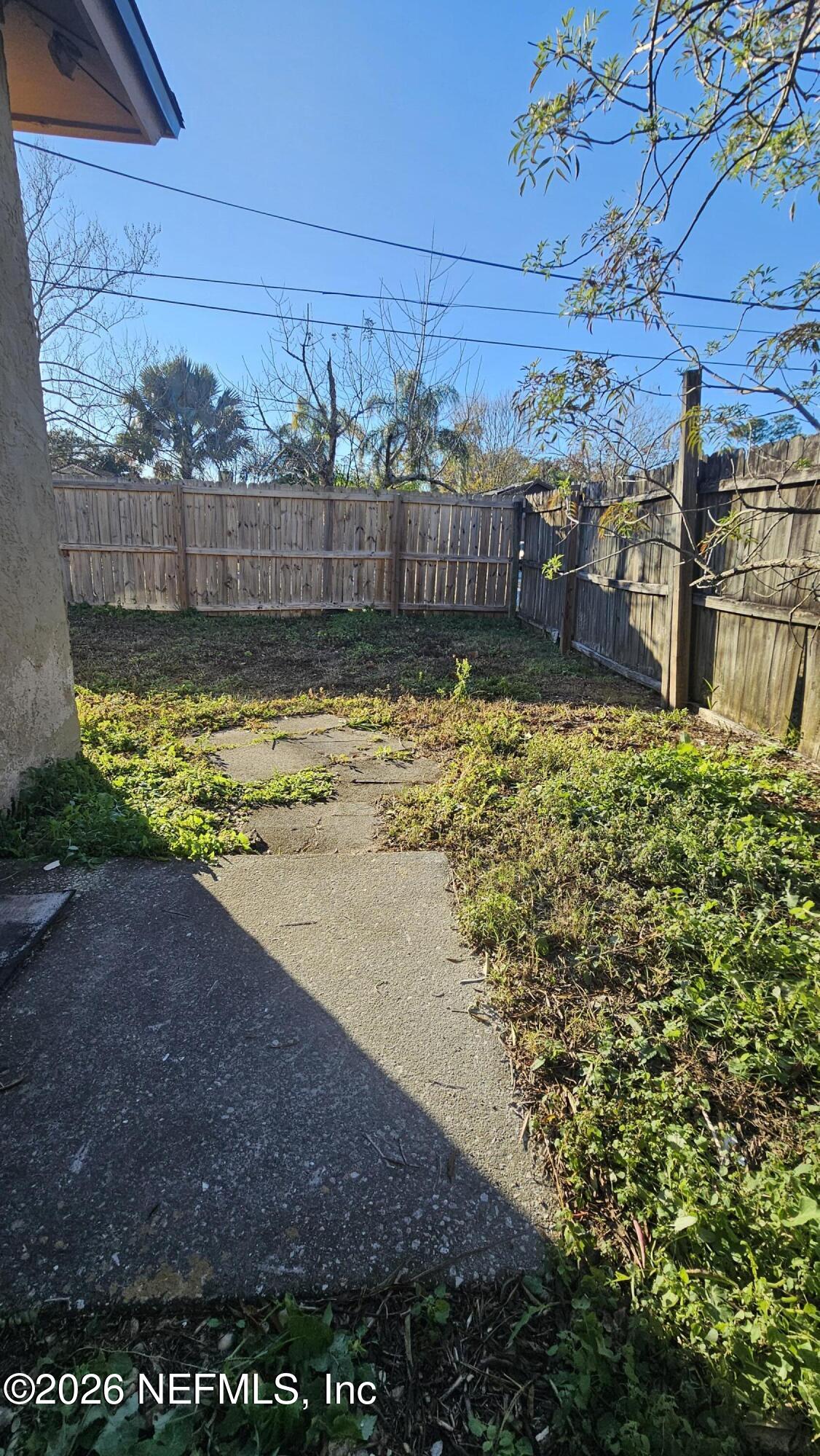 820 Orchid Street Atlantic Beach, FL 32233 - Photo 26 of 27 a view of a yard with wooden fence
