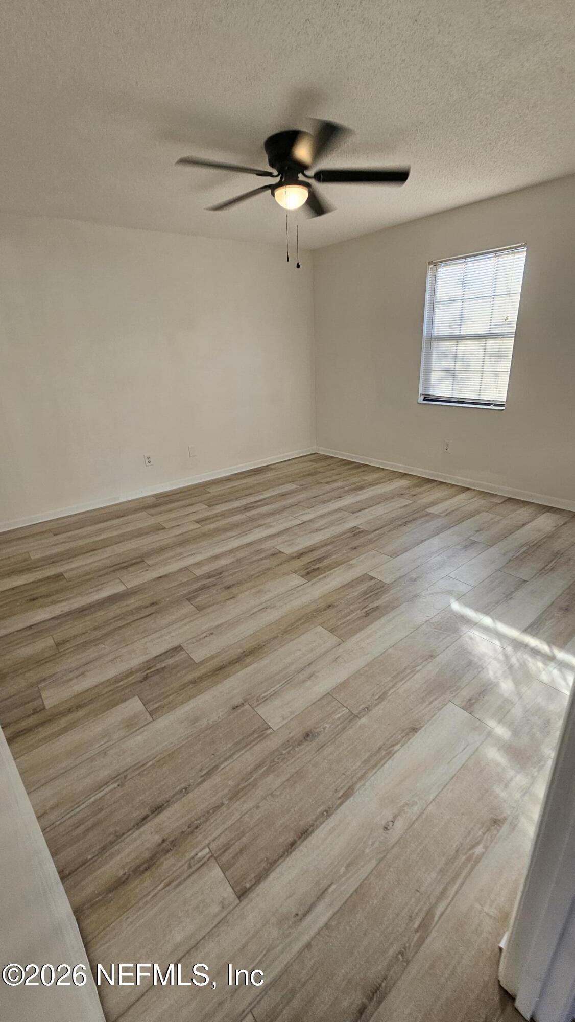 820 Orchid Street Atlantic Beach, FL 32233 - Photo 10 of 27 wooden floor in an empty room