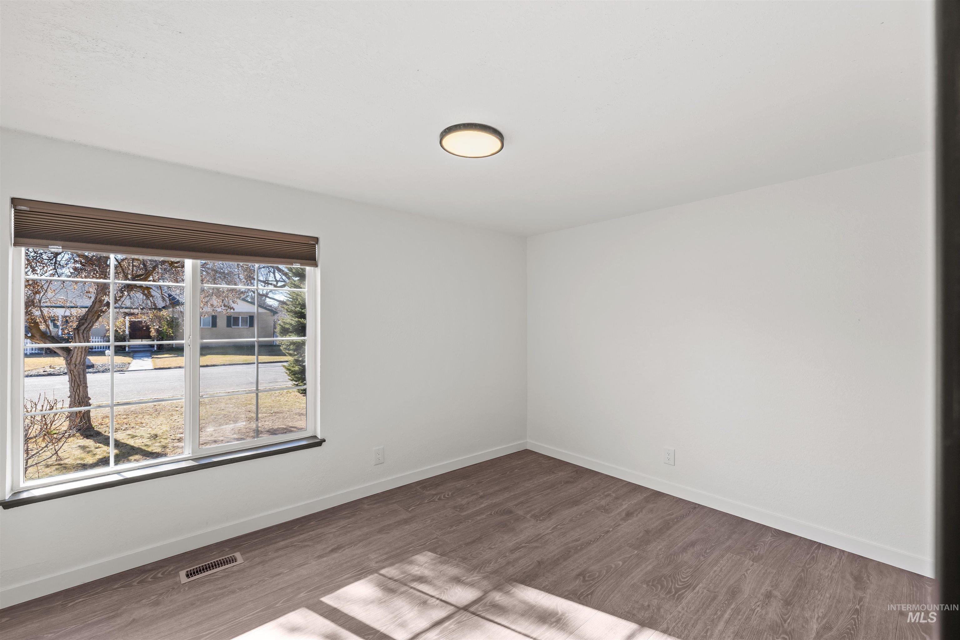 3154 South McCormick Way Boise, ID 83709 - Photo 16 of 50 Unfurnished room with wood finished floors