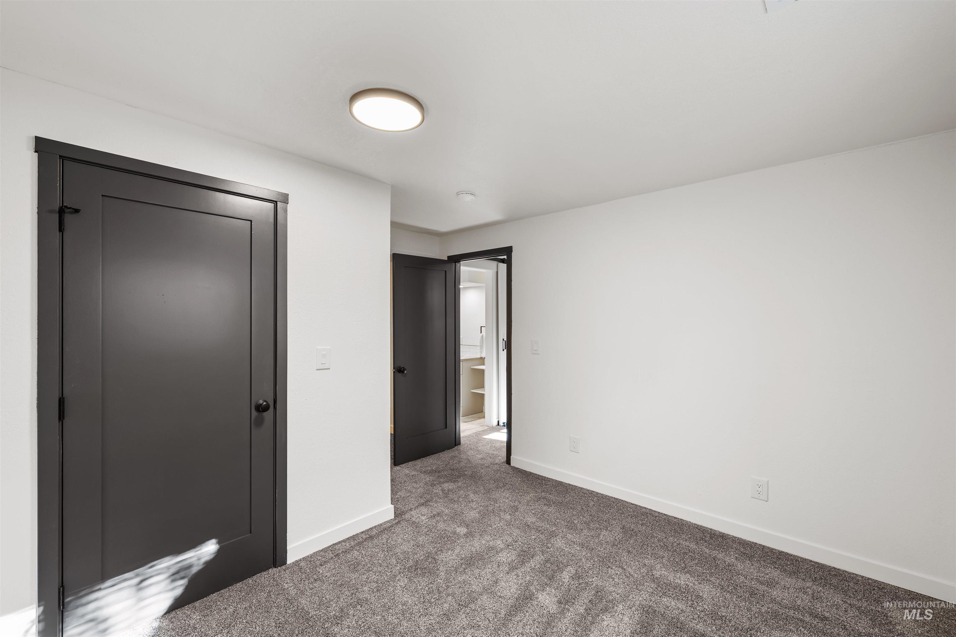 3154 South McCormick Way Boise, ID 83709 - Photo 28 of 50 Unfurnished bedroom with a closet and carpet flooring
