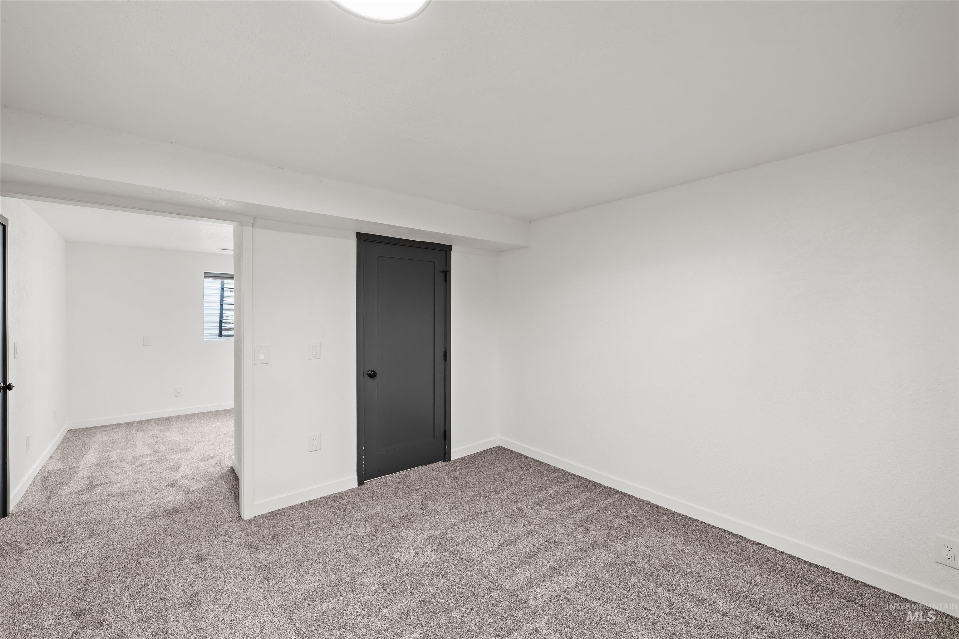 3154 South McCormick Way Boise, ID 83709 - Photo 30 of 50 Unfurnished bedroom featuring carpet floors and baseboards