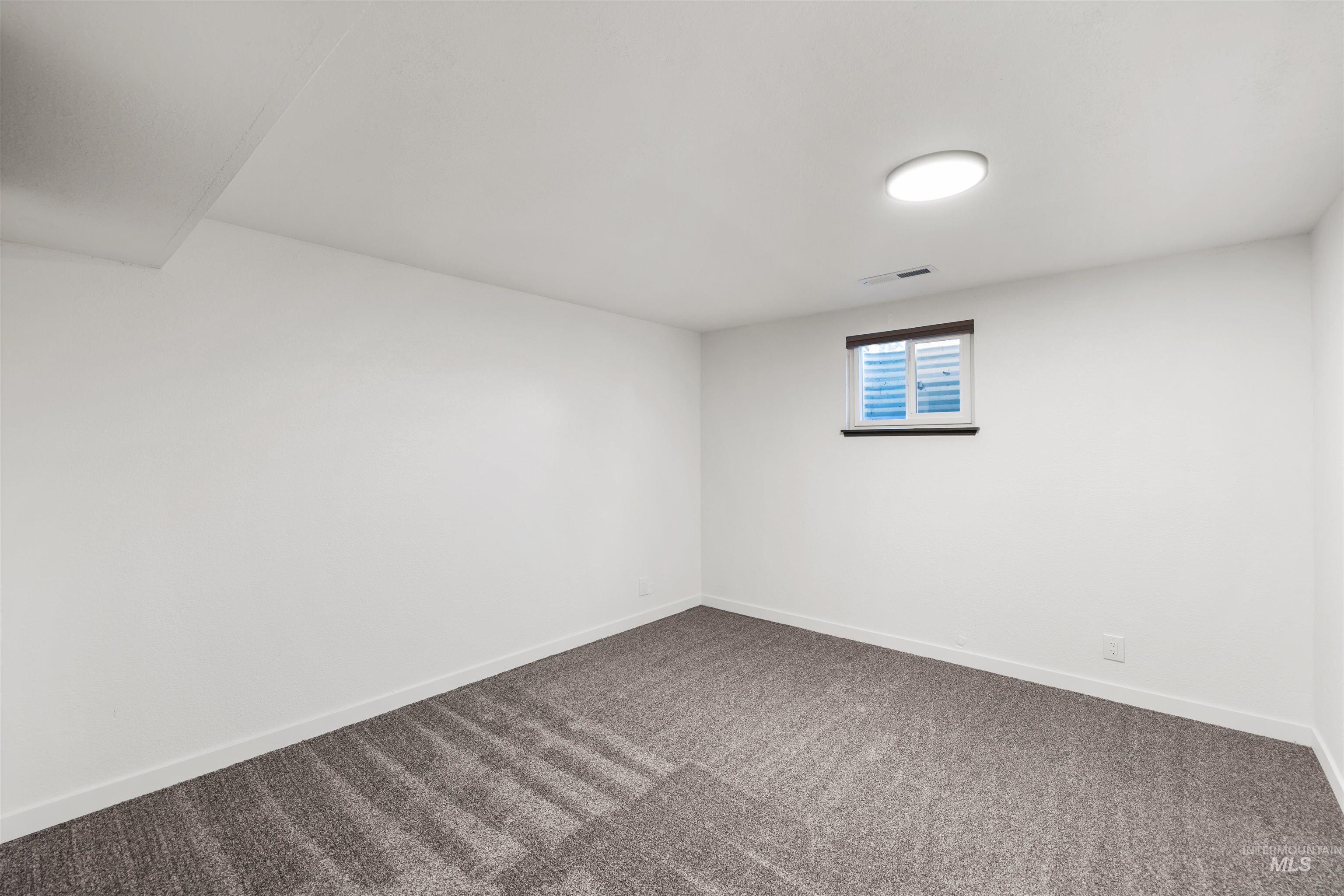 3154 South McCormick Way Boise, ID 83709 - Photo 31 of 50 Carpeted empty room with baseboards