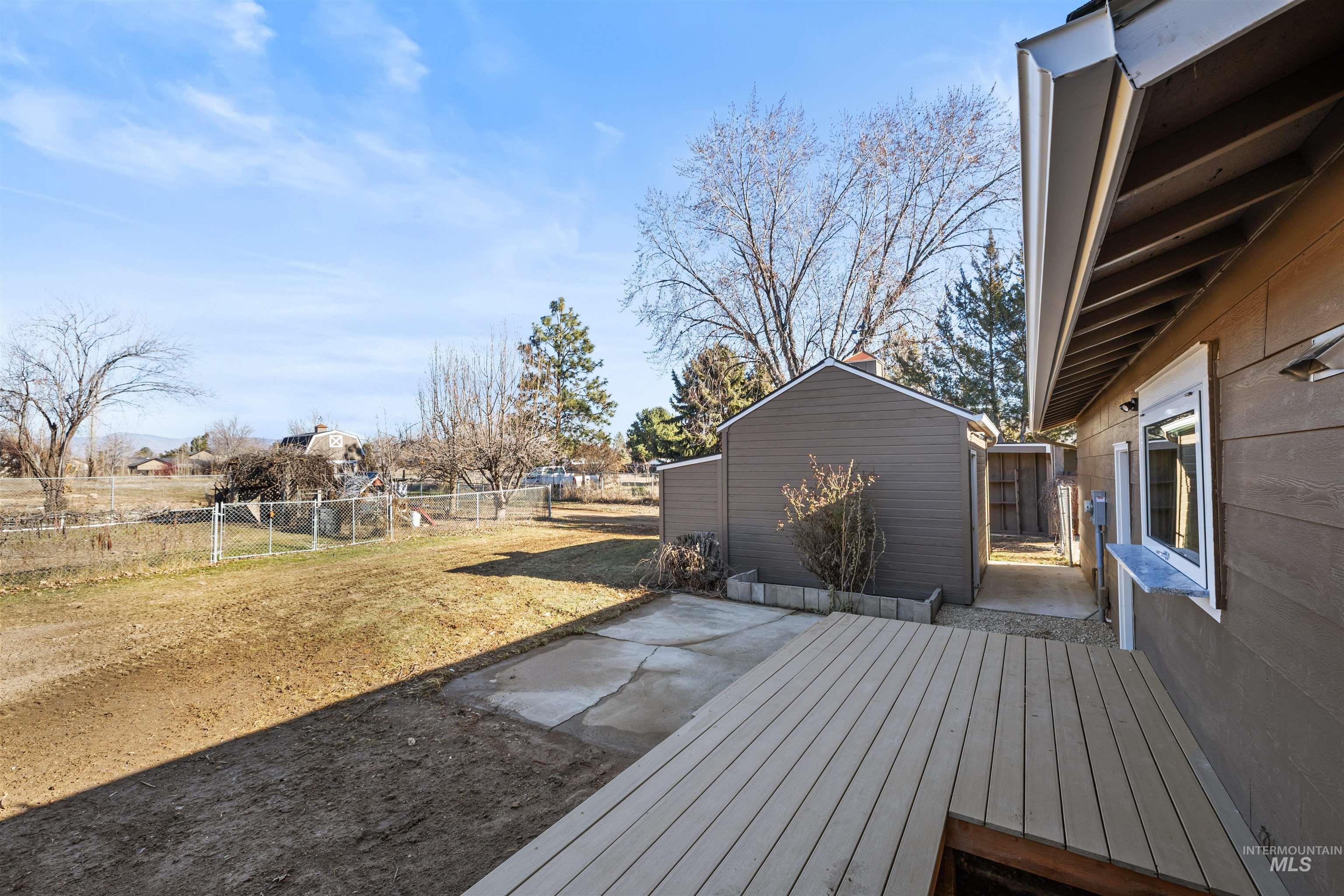 3154 South McCormick Way Boise, ID 83709 - Photo 33 of 50 Wooden deck featuring a fenced backyard, a patio, and a storage shed