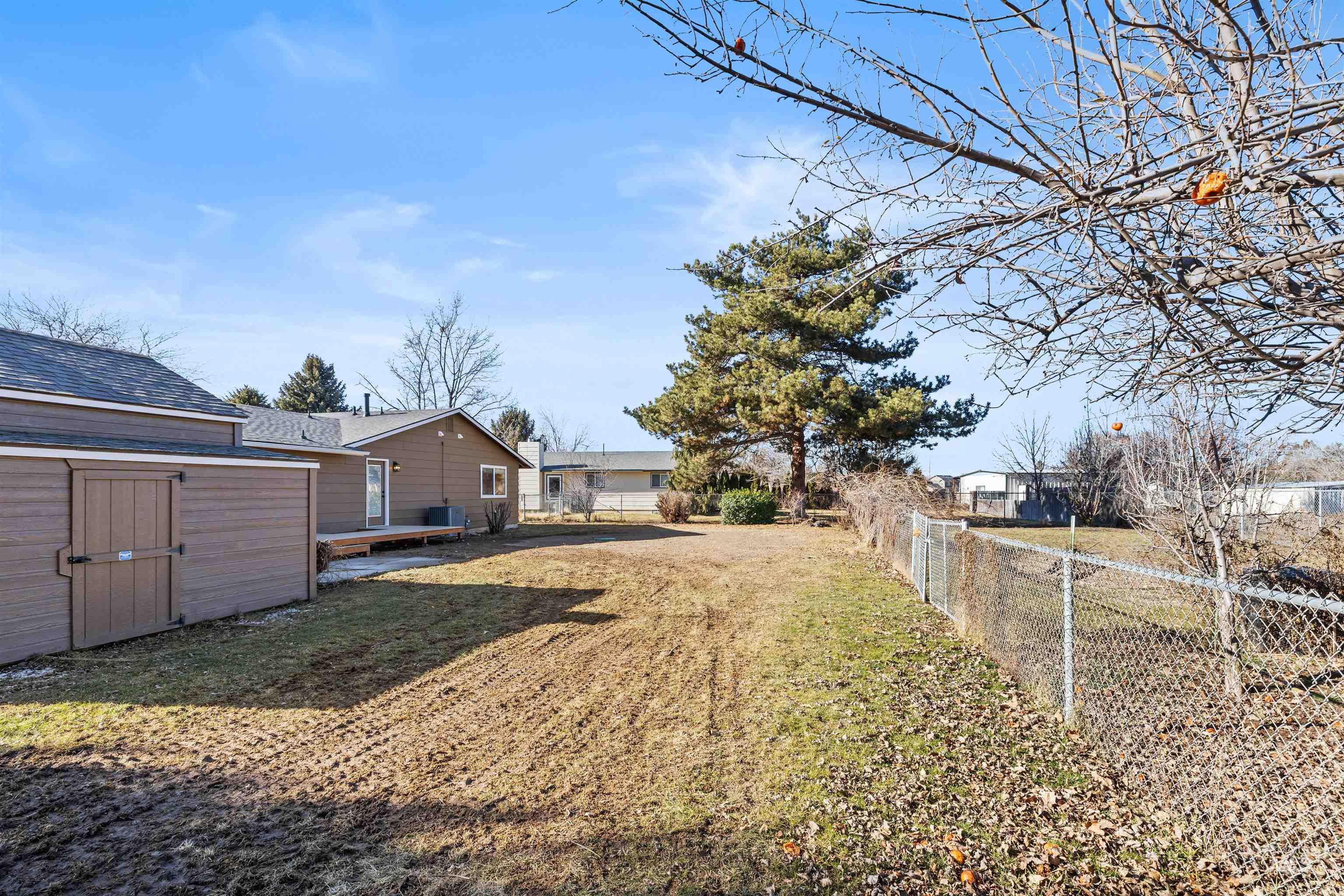3154 South McCormick Way Boise, ID 83709 - Photo 36 of 50 Fenced yard with a storage unit