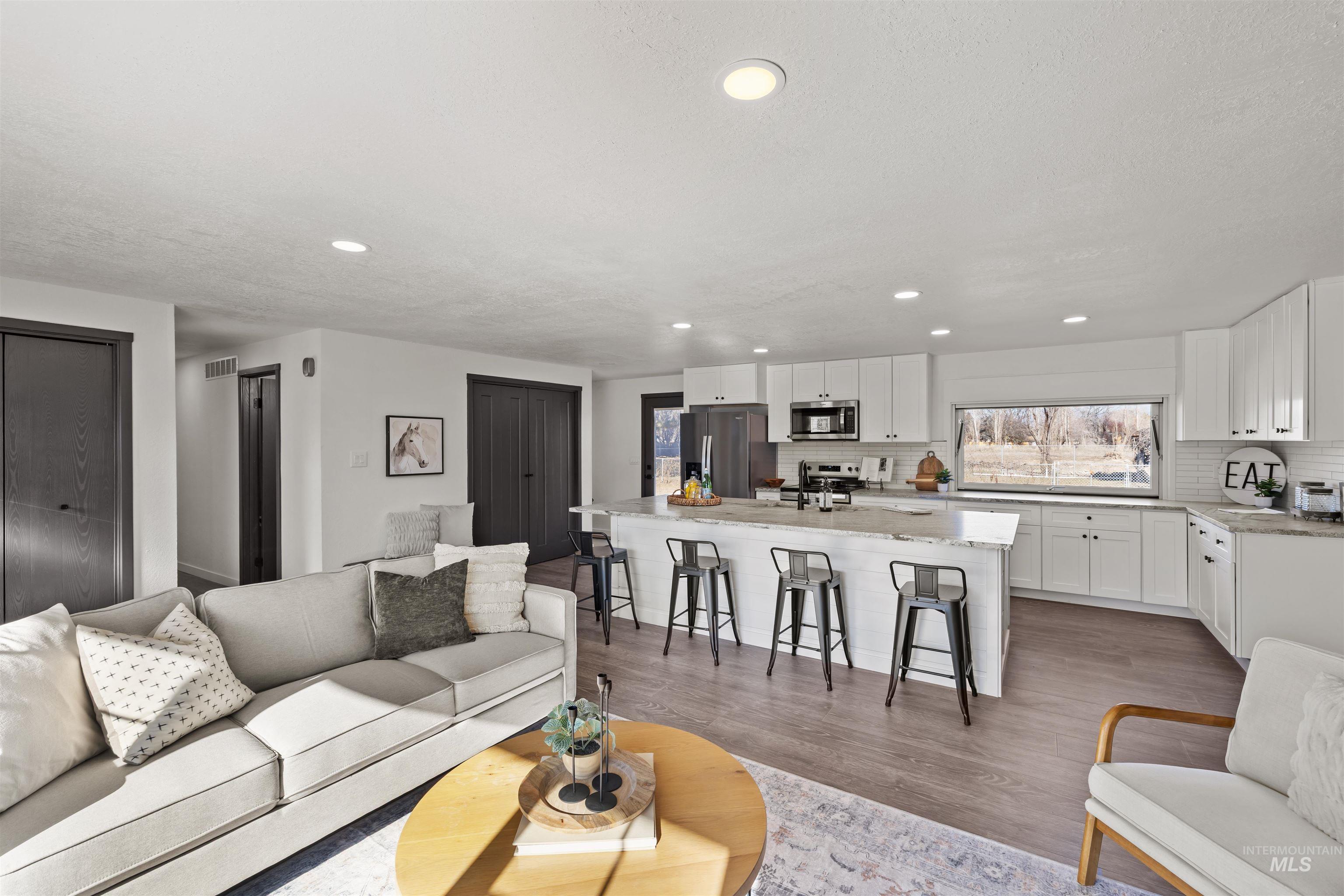 3154 South McCormick Way Boise, ID 83709 - Photo 6 of 50 Living area featuring recessed lighting and light wood-type flooring
