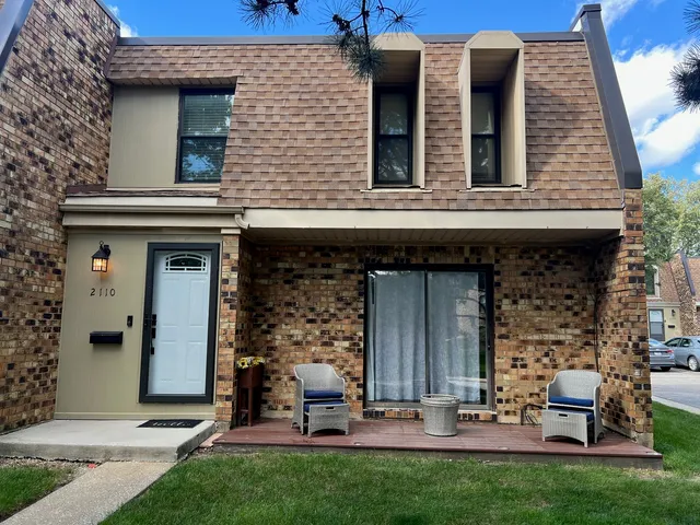 front view of house with table and chairs