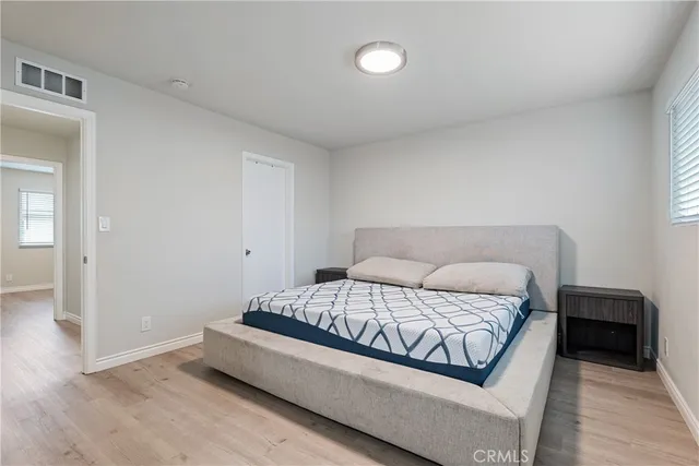 a bedroom with a bed and a cabinets