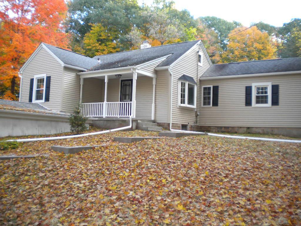 56 Northford Road Wallingford, CT 06492 - Photo 1 of 1 front view of house with a yard