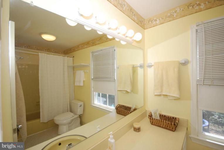 4416 Rendale Court Olney, MD 20832 - Photo 16 of 28 a bathroom with a sink and a mirror