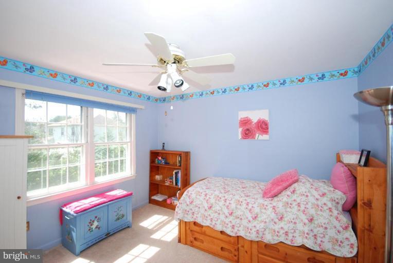 4416 Rendale Court Olney, MD 20832 - Photo 18 of 28 a bedroom with furniture and a window