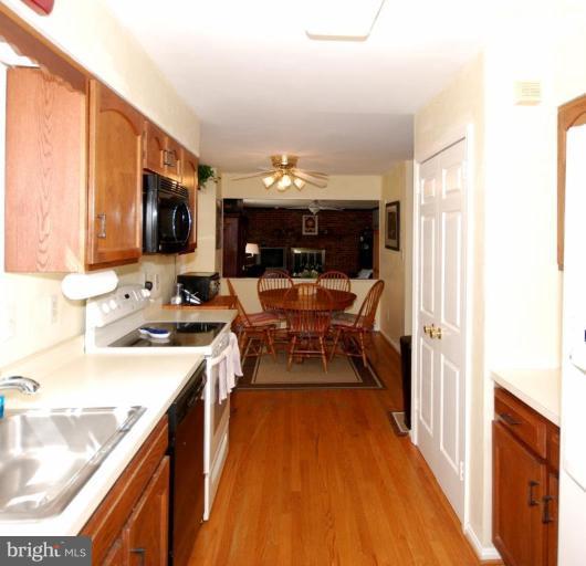 4416 Rendale Court Olney, MD 20832 - Photo 8 of 28 a kitchen with stainless steel appliances granite countertop a sink stove and refrigerator