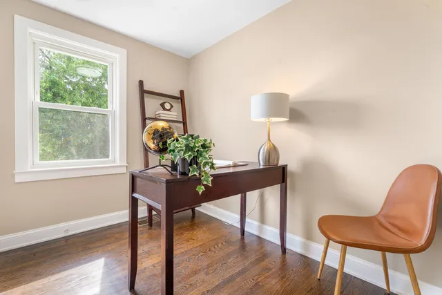 a workspace with furniture and a window