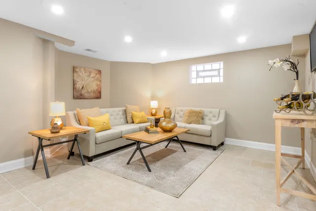 a living room with furniture and a table