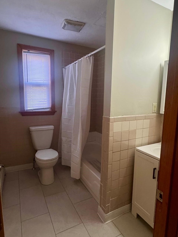 68 Maverick Street Chelsea, MA 02150 - Photo 13 of 16 a bathroom with a toilet and a shower