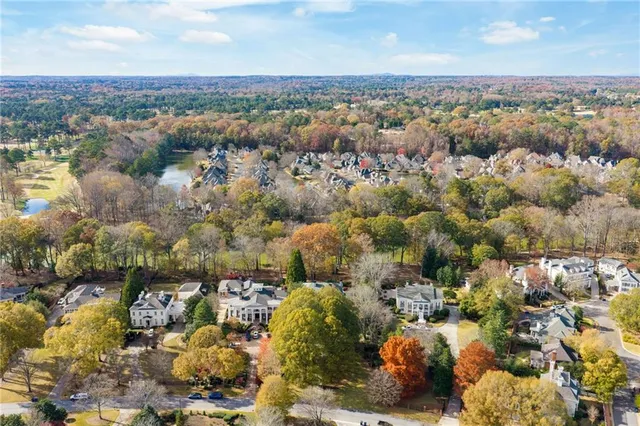 a view of an entryway with wooden floor and staircase