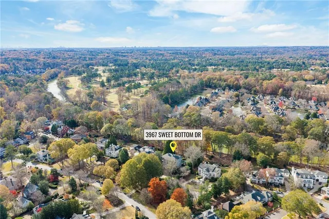 a living room with fireplace furniture and a large window
