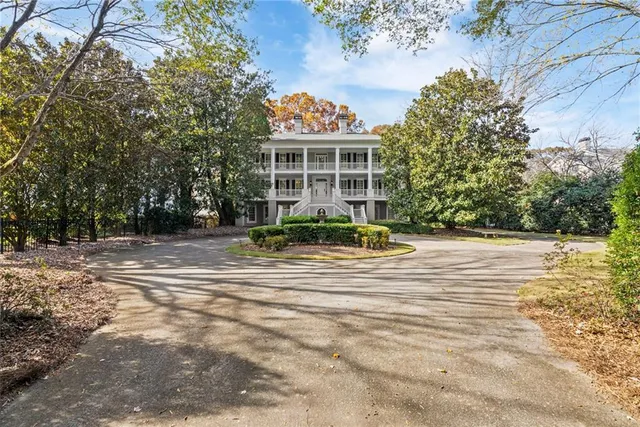 a view of a kitchen counter top a sink and a window