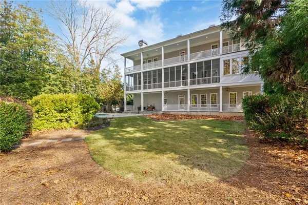 a view of an empty room with a ceiling fan