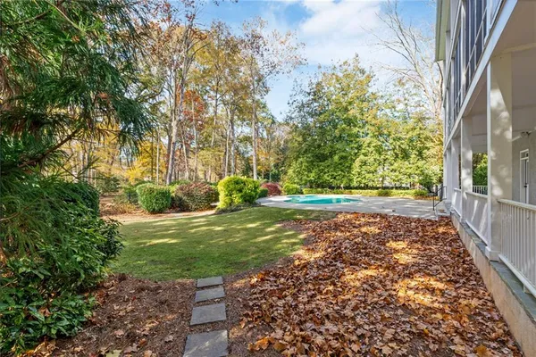 a view of an empty room with a ceiling fan