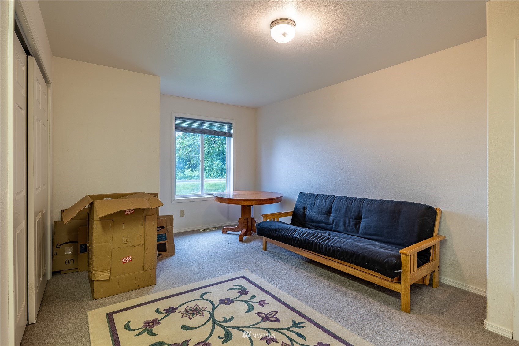 1659 West Gillis Road Othello, WA 99344 - Photo 23 of 38 a living room with furniture and a window