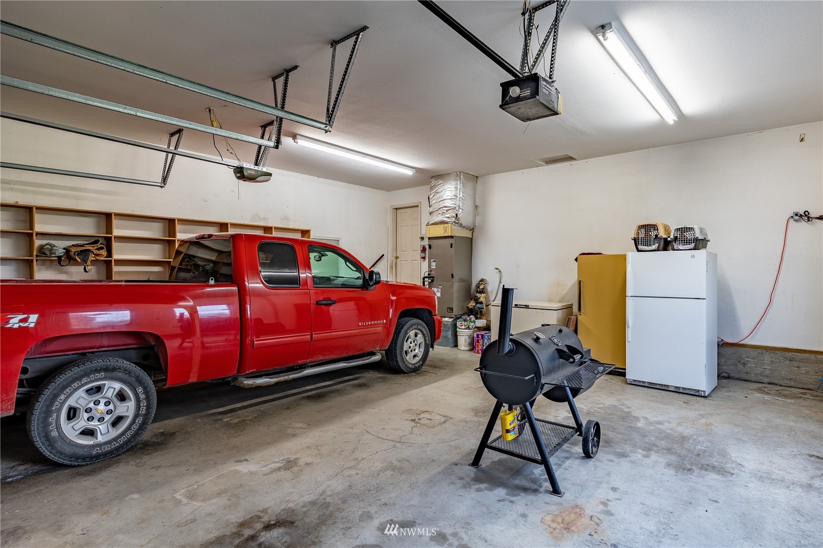 1659 West Gillis Road Othello, WA 99344 - Photo 27 of 38 a car is parked in a room
