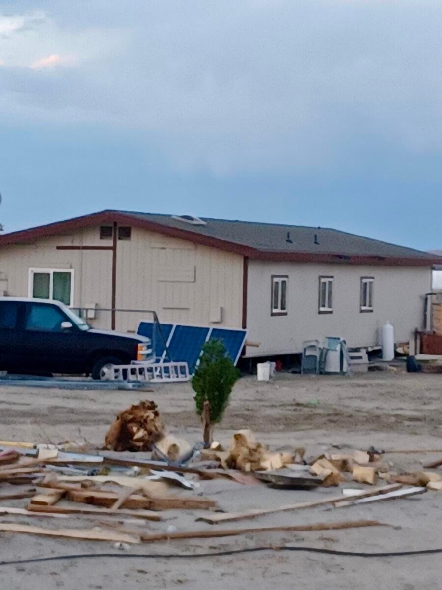 a view of a kitchen with granite countertop a stove and a sink