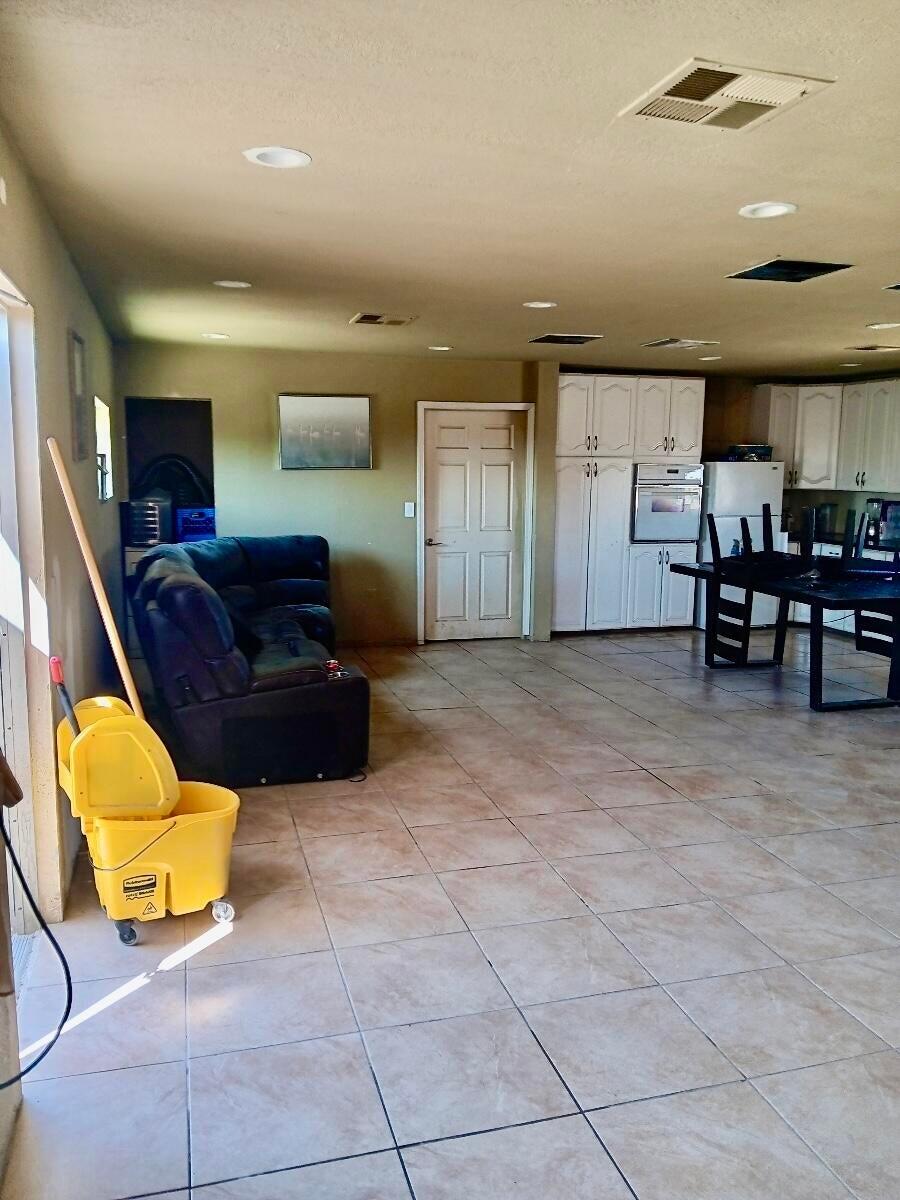 20025 Chamisal Street Adelanto, CA 92301 - Photo 27 of 46 a living room with furniture