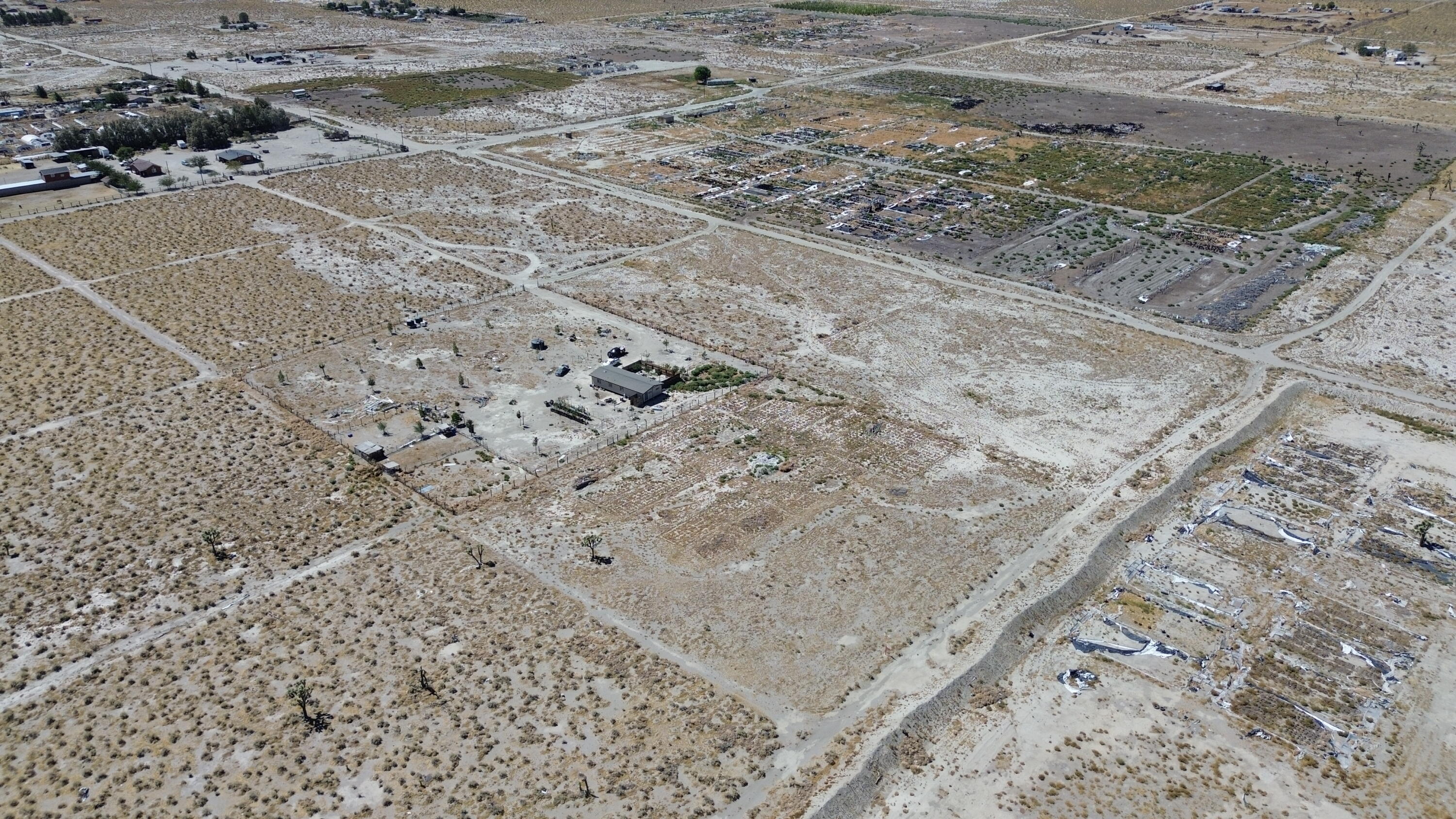 20025 Chamisal Street Adelanto, CA 92301 - Photo 38 of 46 a view of a dry yard with wooden fence