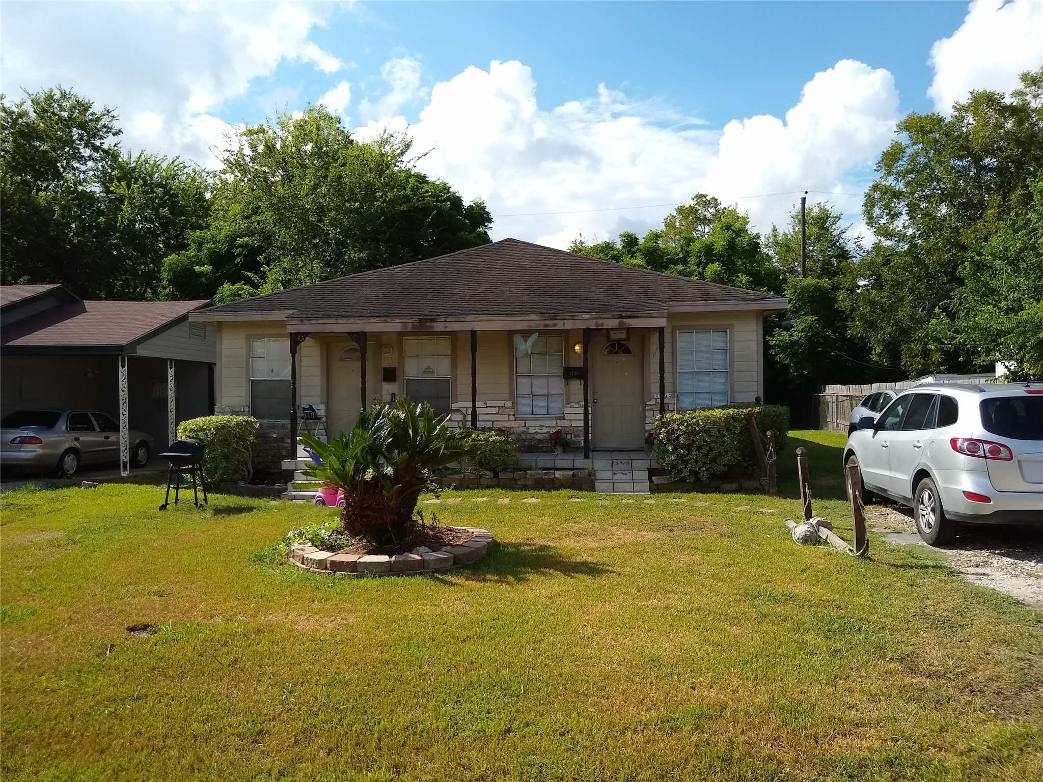a front view of a house with swimming pool having outdoor seating