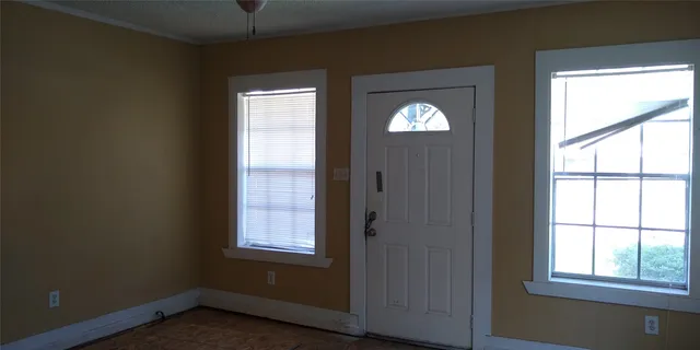 a view of empty room with windows