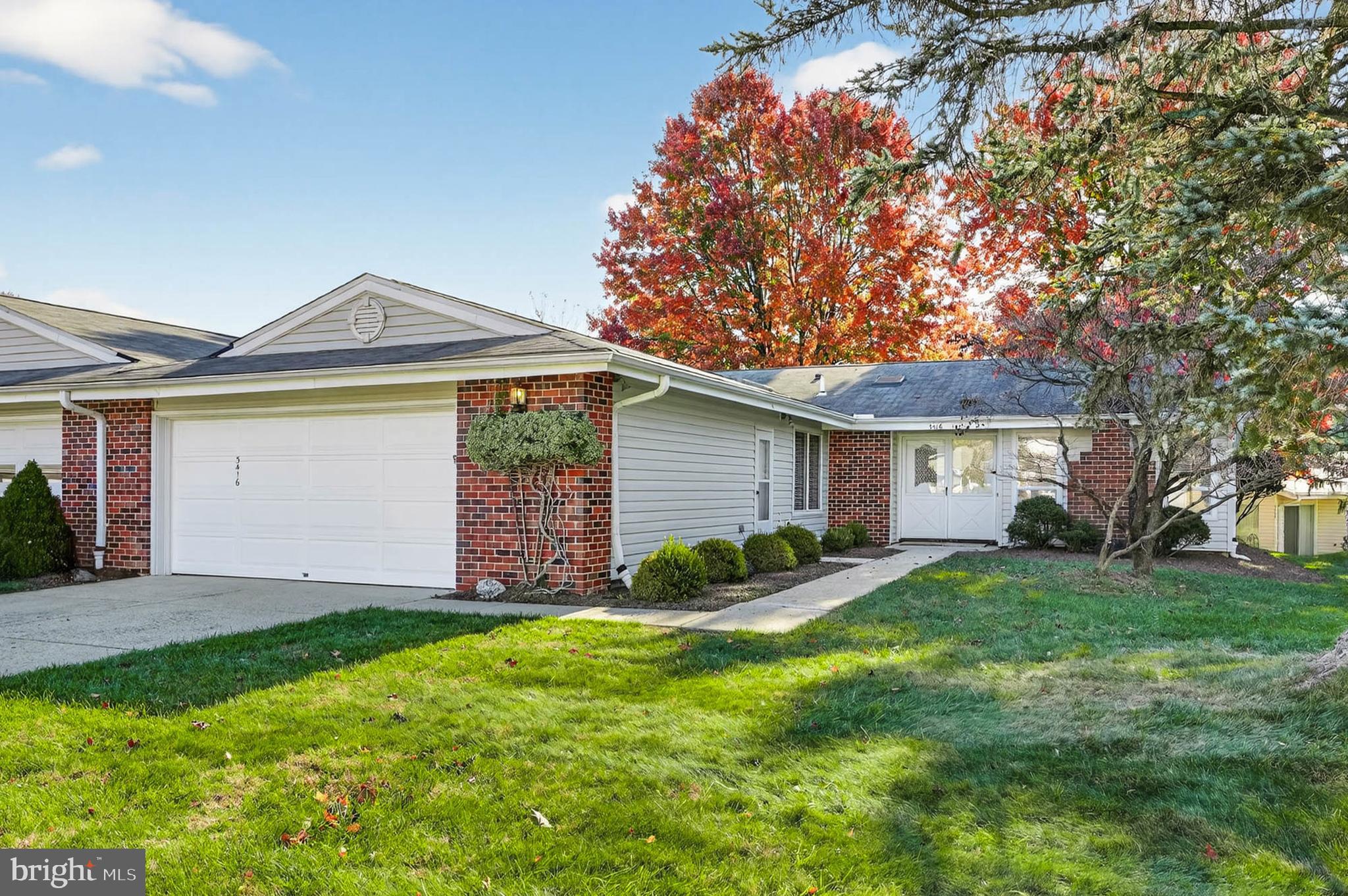3416 Island Creek Court, Unit 127C Silver Spring, MD 20906 - Photo 1 of 60 a view of a house with a yard and large tree
