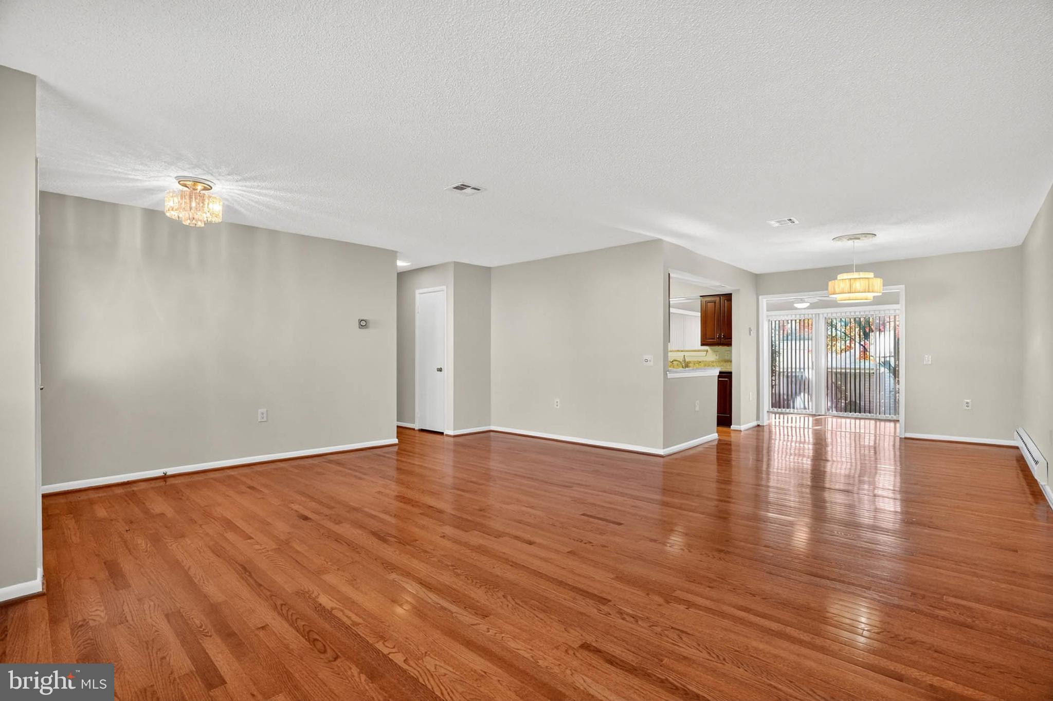 3416 Island Creek Court, Unit 127C Silver Spring, MD 20906 - Photo 6 of 60 a view of an empty room with wooden floor