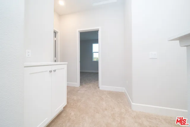 a view of a room with a hallway