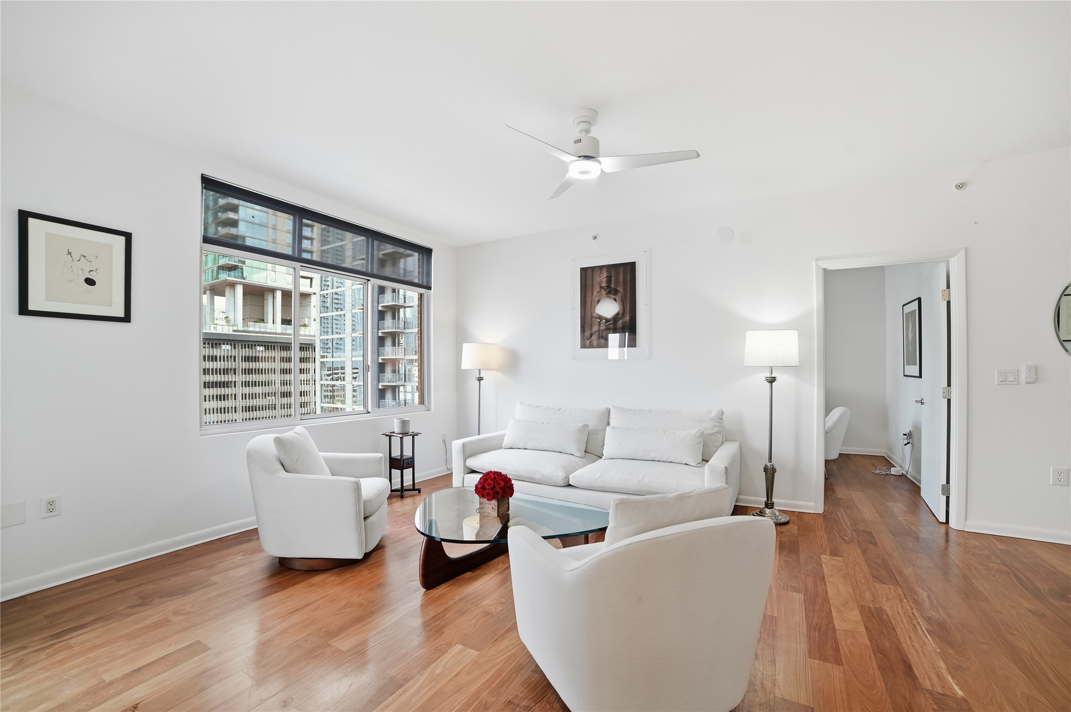 54 Rainey Street, Unit 1018 Austin, TX 78701 - Photo 5 of 32 a living room with furniture and a large window