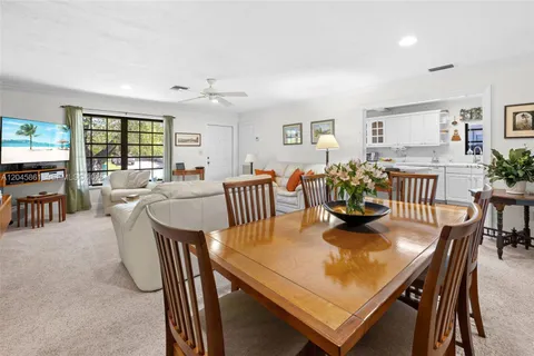 a view of a dining room with furniture and window