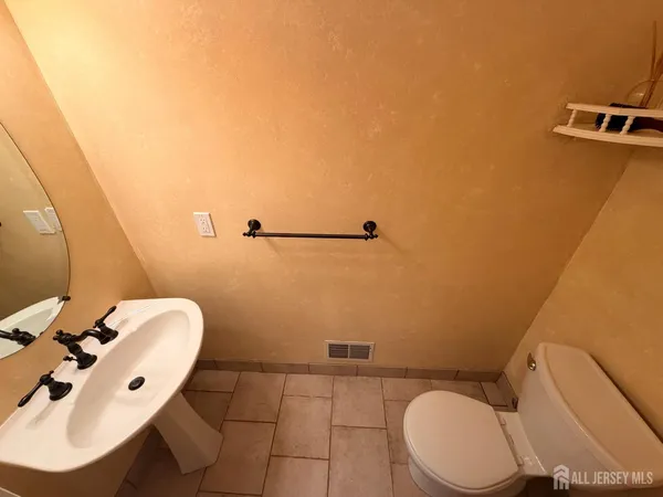 a bathroom with a toilet and a sink