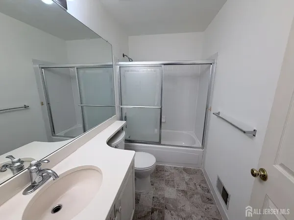a bathroom with a sink and toilet