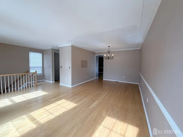 a view of a hallway with an empty room