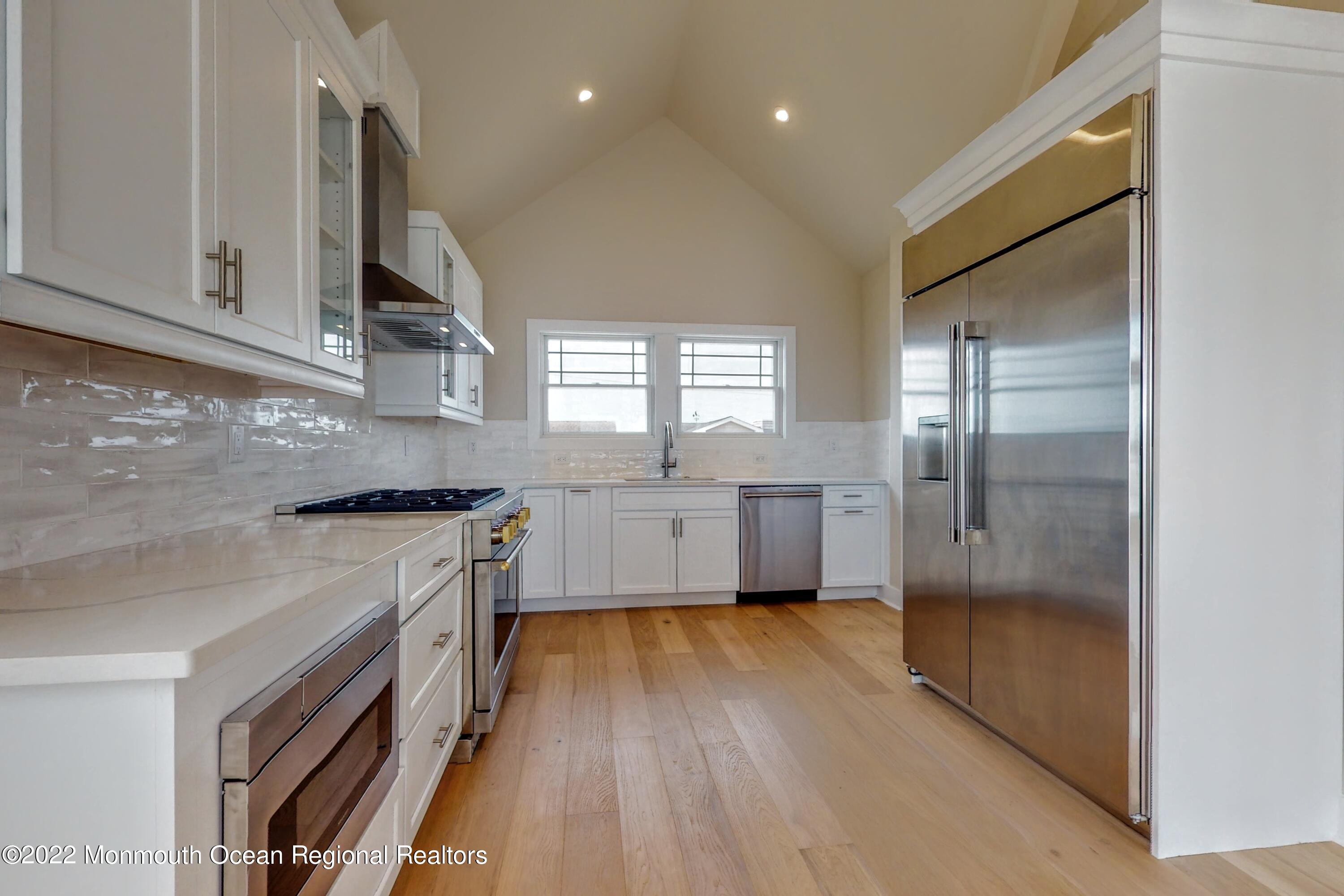 48 Muriel Drive Manahawkin, NJ 08050 - Photo 17 of 89 a kitchen with stainless steel appliances a refrigerator sink and cabinets