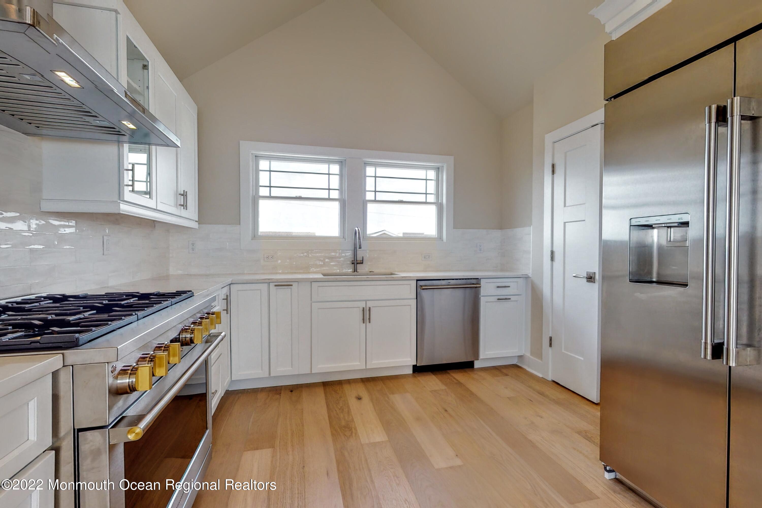 48 Muriel Drive Manahawkin, NJ 08050 - Photo 18 of 89 a kitchen with granite countertop a sink cabinets stainless steel appliances and a window