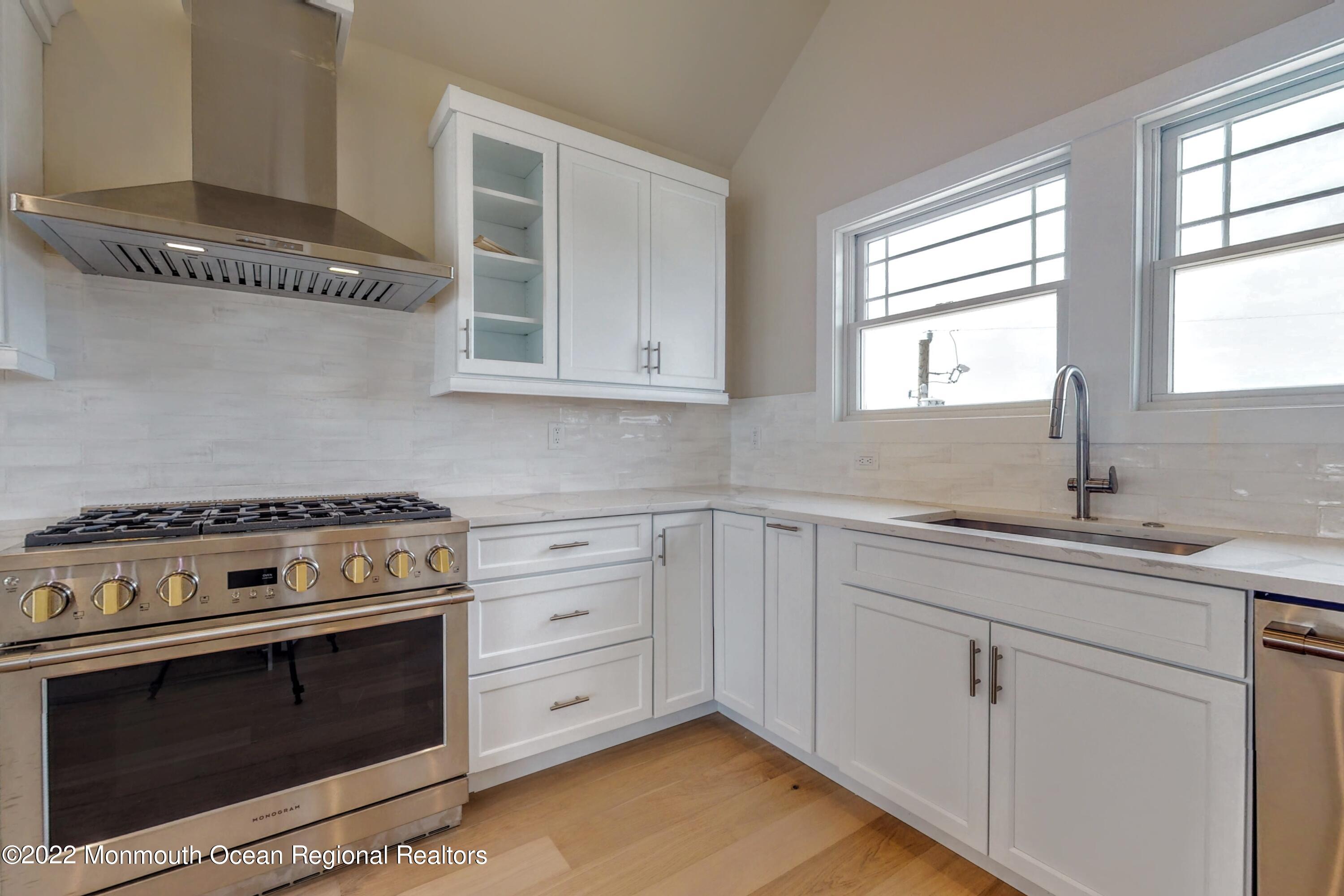 48 Muriel Drive Manahawkin, NJ 08050 - Photo 19 of 89 a kitchen with cabinets appliances and a window